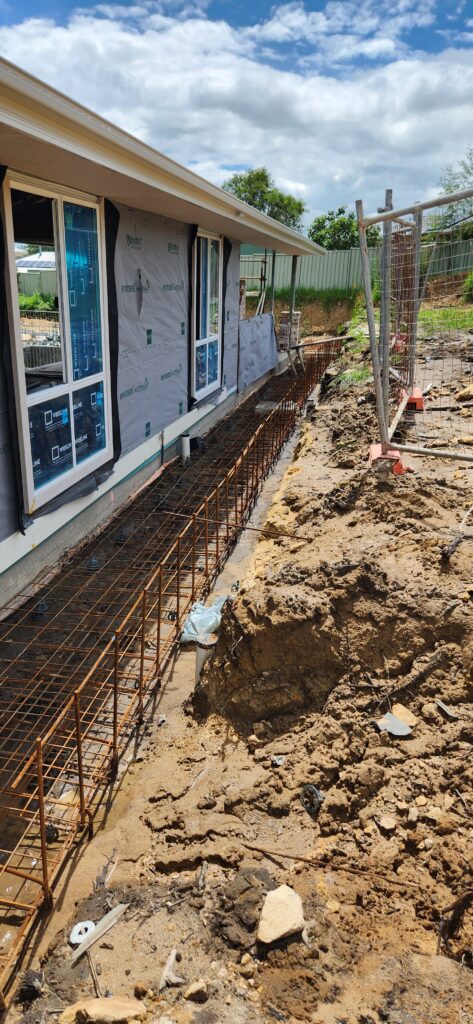 Reinforced retaining wall design by Strive Engineering Sydney Structural engineer designing reinforced concrete retaining wall in Sutherland Shire